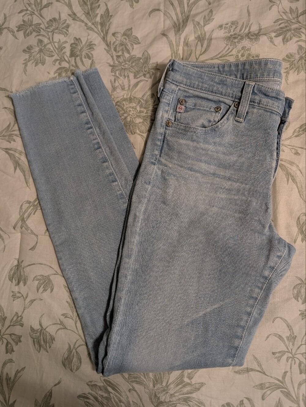 AG Adriano Goldschmied Light Wash Skinny Jeans With Frayed Hem